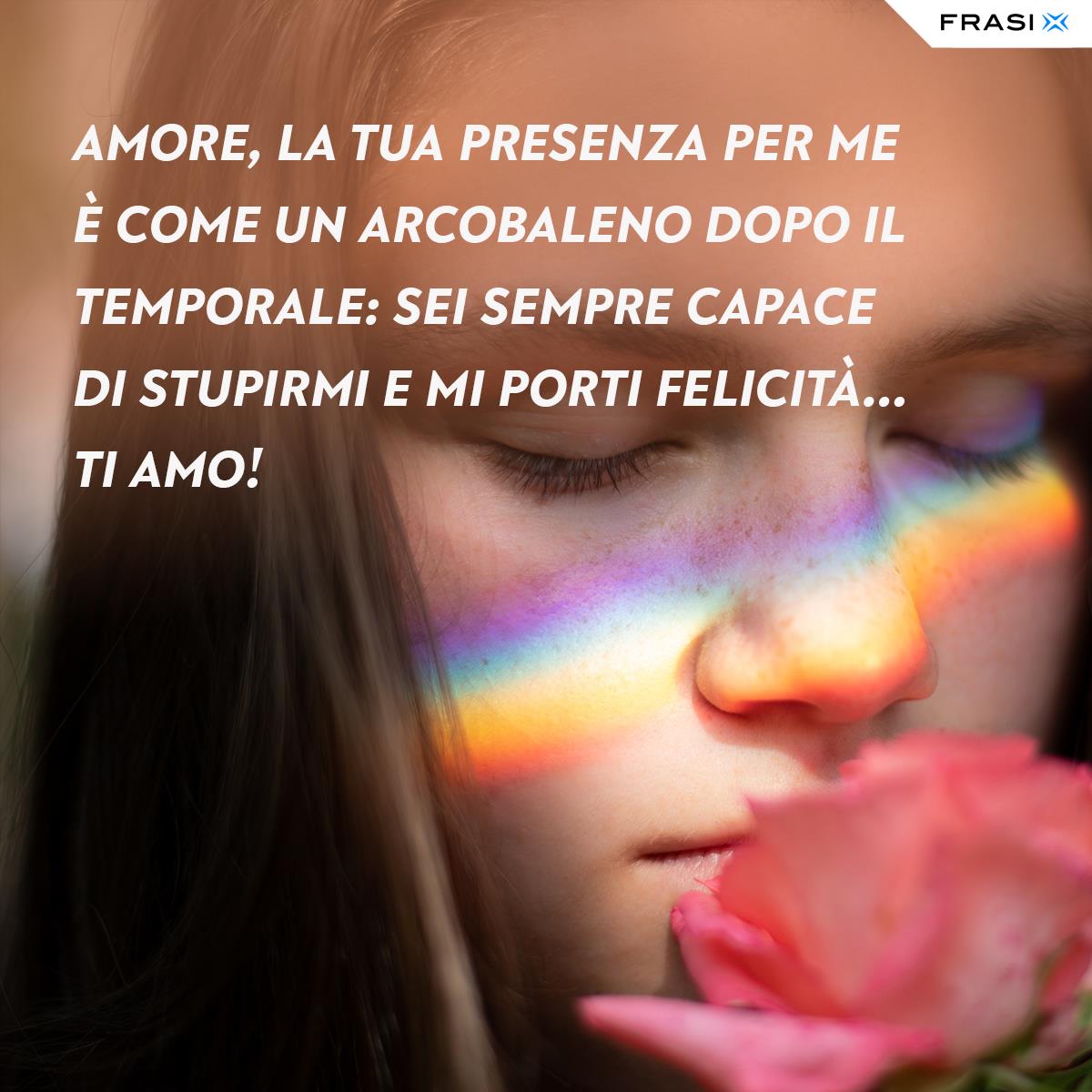 Immagine ragazza con rosa e frase amore arcobaleno